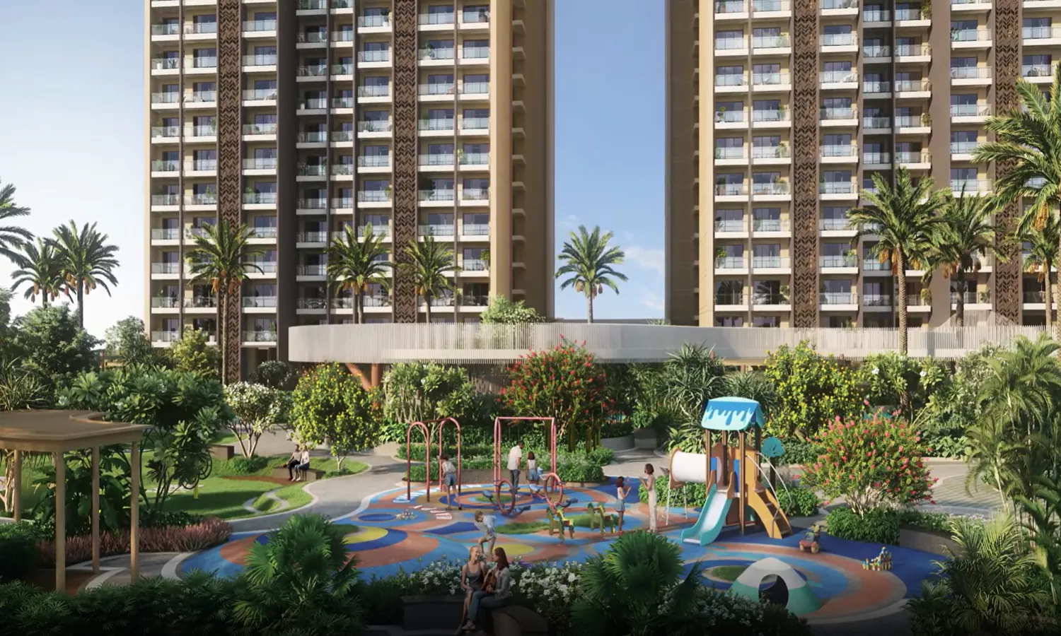 Evening view of the Experion Cascades residential project in Sector 88A North Bangalore, featuring a large illuminated swimming pool, poolside loungers, landscaped greenery, and modern high-rise apartment towers in the background